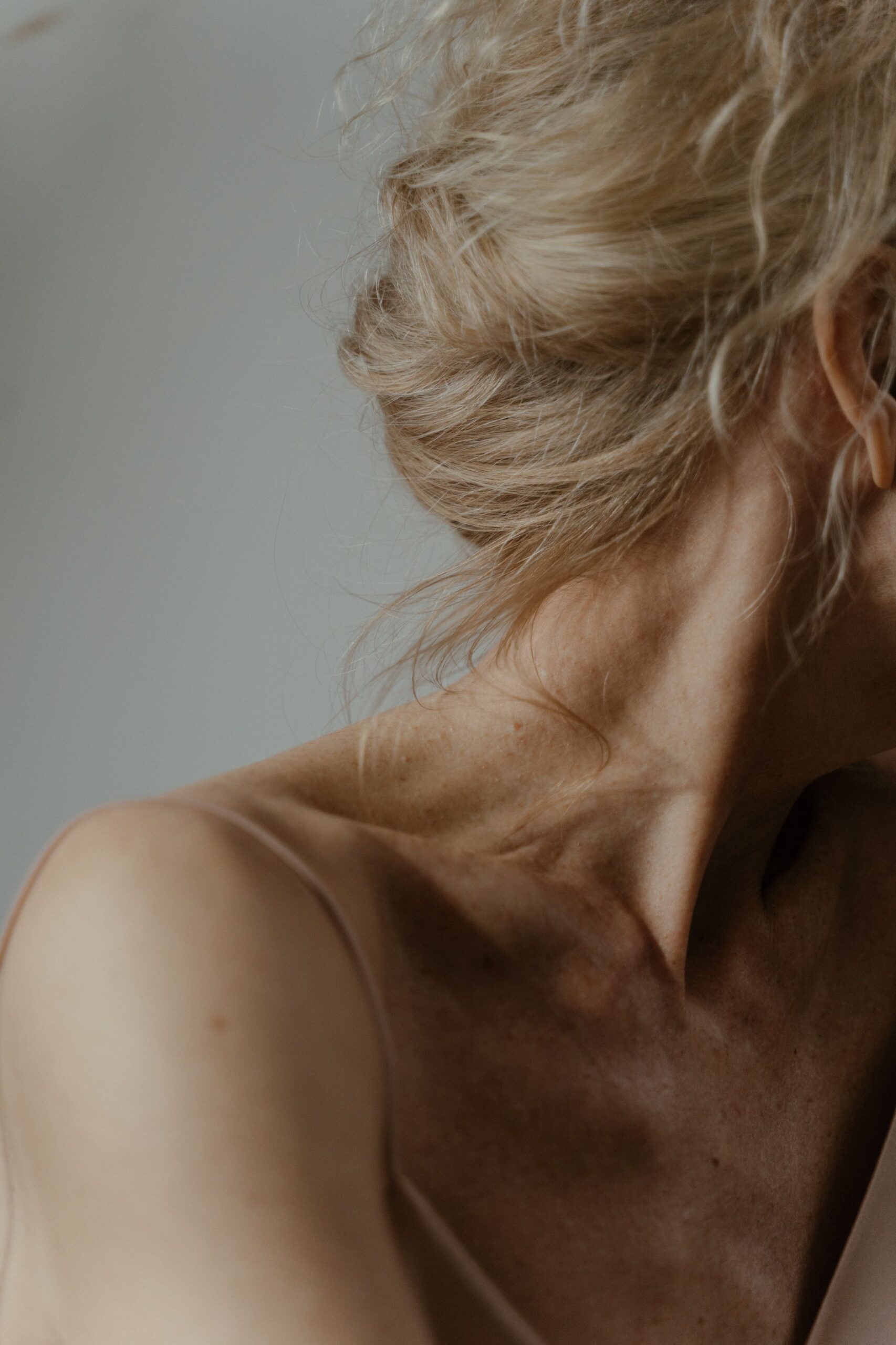 Close up of woman's skin with head turned away from camera